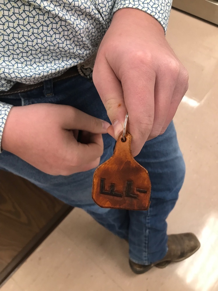 student showing keychain