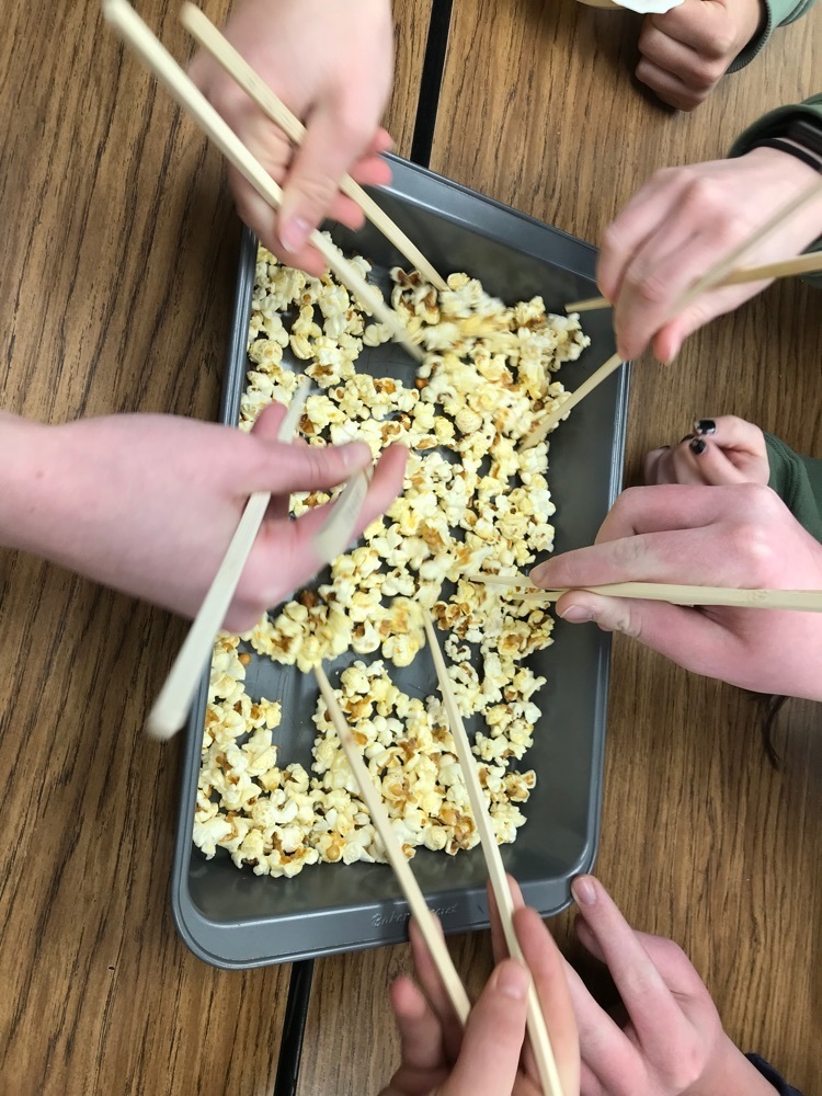 students using chopsticks