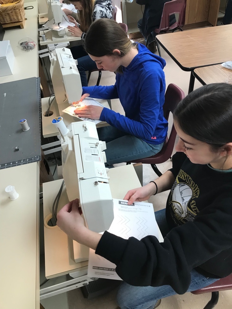 students using sewing machine