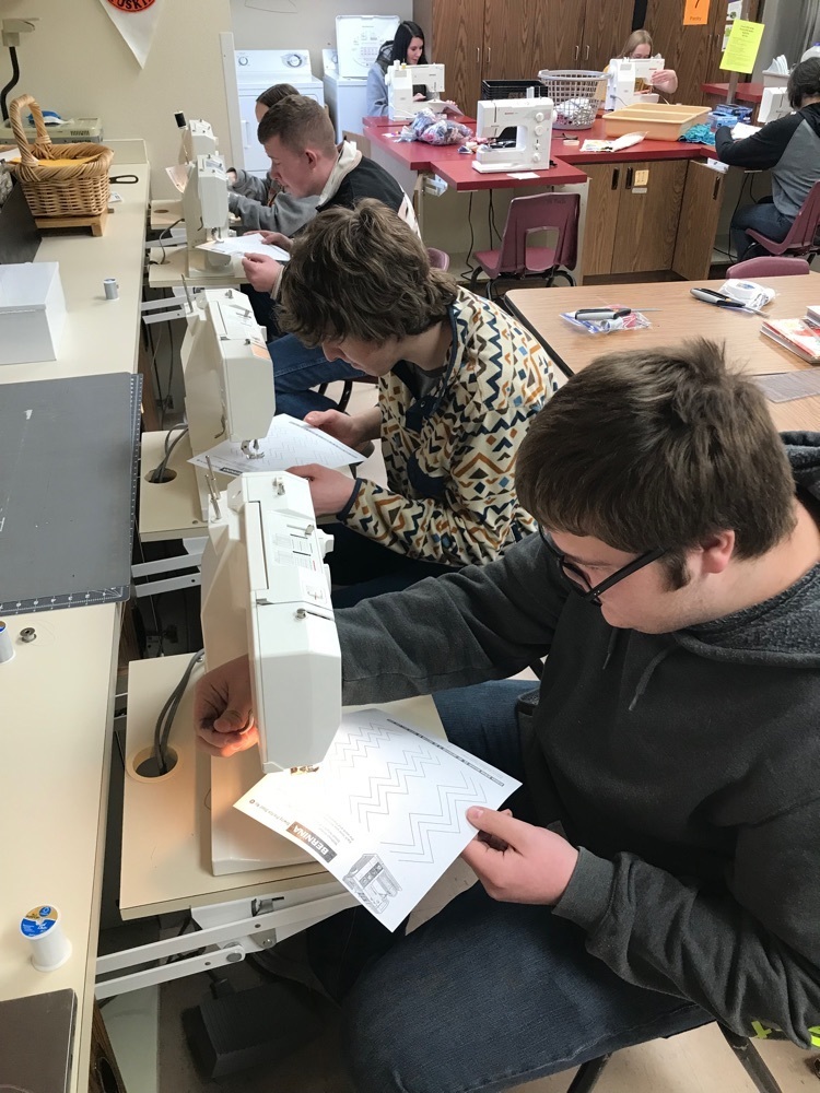 students using sewing machine