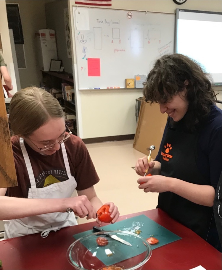 student prepares tomato