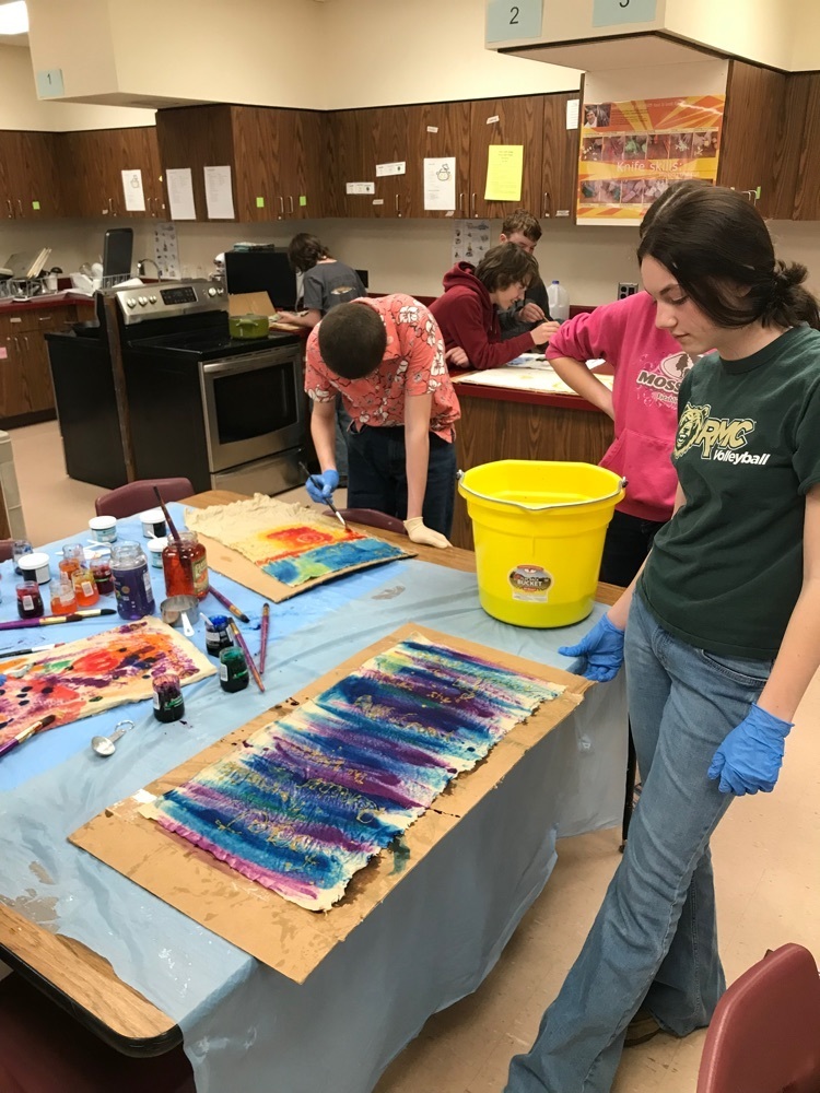 students showing off fabric