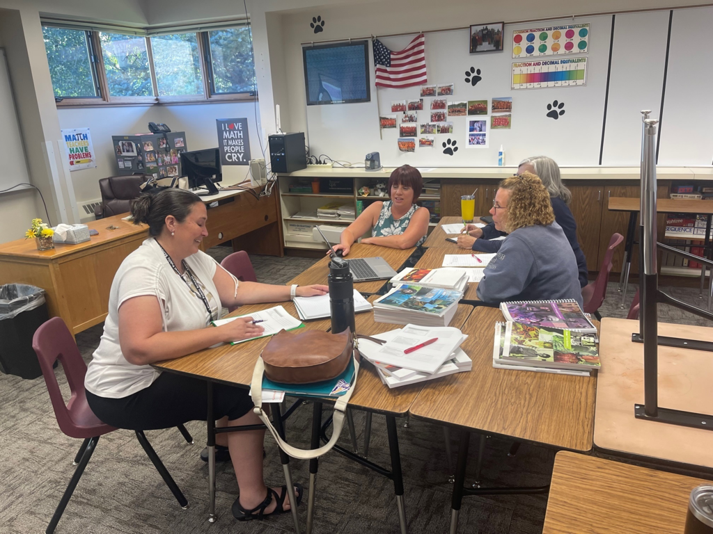 teacher at desks