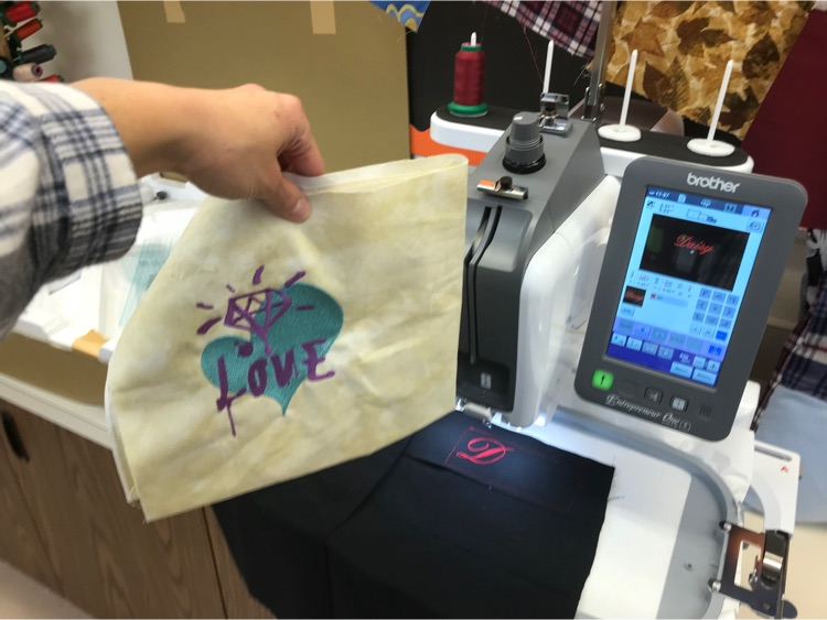 Students are putting the new embroidery machine to work.